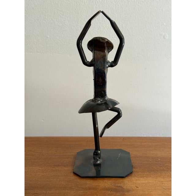 This brutalist sculpture is formed from a railroad spike and other pieces of metal. Heavy and substantial. Most items...