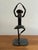 This brutalist sculpture is formed from a railroad spike and other pieces of metal. Heavy and substantial. Most items...