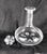This is a signed Orrefors decanter in an unknown pattern. The decanter is large and heavy with a petal shaped cut in the...
