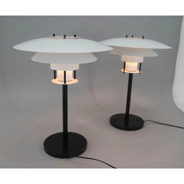 Set of two Danish Laterna Danica table lamps designed by Jorgen Buchwald. Made of lacquered metal. Very good original...