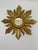 A splendid hand carved petite 11" diameter French Giltwood Sunburst Wall Mirror, circa 1950s. The center 2.25" flat mirror...
