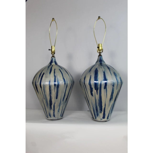 A substantial pair Laurel influence table lamps. The enamel overlay with drip gaze,. creating a Mica like effect....