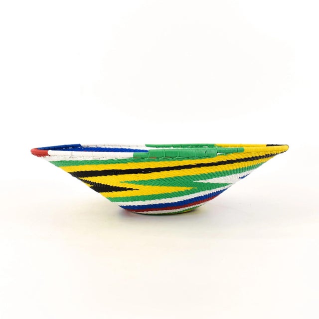 Zulu Telephone Wire Baskets from South Africa epitomize the fusion of traditional craftsmanship and contemporary...