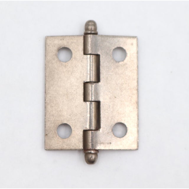 Vintage cabinet hinge made of brushed steel with button tips, five knuckles, and a template hole pattern. The original...