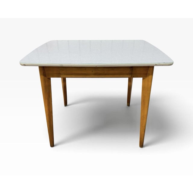This Mid-Century Modern Heywood Wakefield Style Arts & Crafts Writing Desk is a stylish and functional piece of furniture...