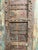 Rich with old-world charm and architectural history, this antique Haveli door showcases beautifully hand-carved details...