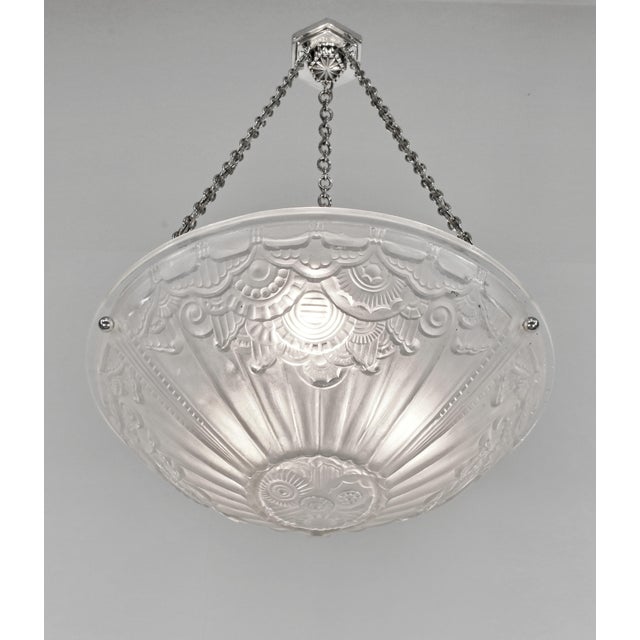 Hettier & Vincent Jean Gauthier (EJG) A French 1930-1935 art deco pendant light by Hettier & Vincent in nickel plated...