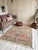 Vintage Boujad Rug | Handwoven Berber Wool Rug with Colorful Tribal Symbols This vibrant vintage Boujad rug features a...