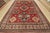 A tribal Caucasian Kazak rug hand-knotted with fine wool on a cotton foundation. This oriental rug features a central...