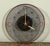 This mid century modern wall clock features a circular copper wire mesh face with a woven mesh center section. The clock...