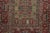 Hand-knotted in wool, this 4x6 Vintage Turkish Anatolian Prayer Rug, circa 1950–1959, features a soft olive mihrab framed...