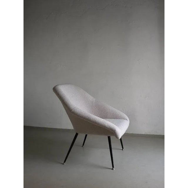 Vintage German shell-form armchair with black metal legs. Condition: new pearl-gray boucle upholstery Country of...