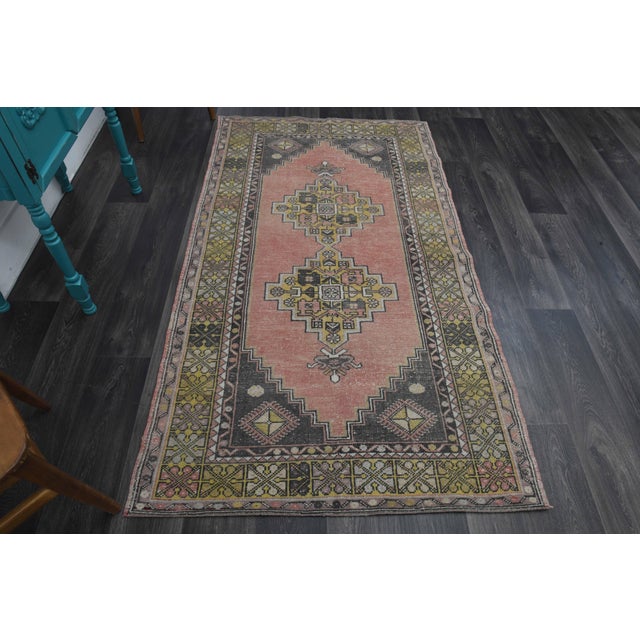 Vintage Hand-Knotted area rug is a semi-antique vintage area rug. The '70s Eastern region of Anatolia's unique rug is...