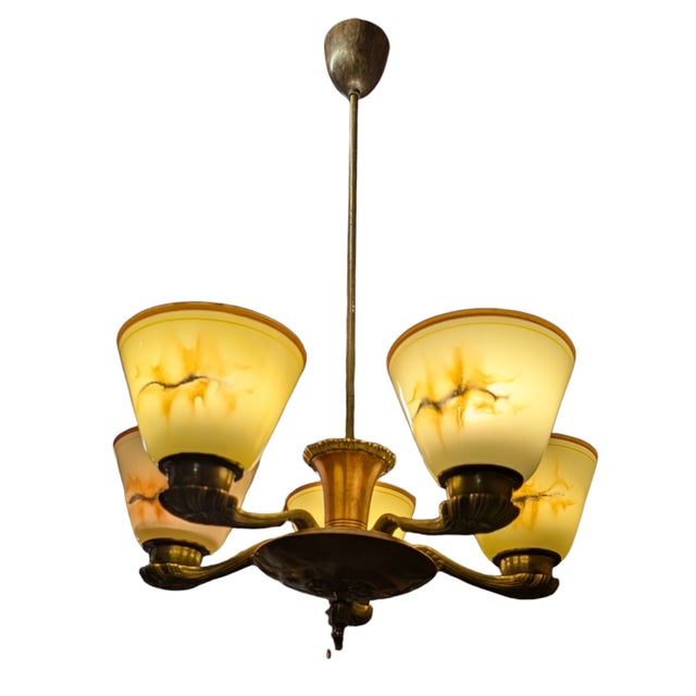 Designed by Paavo Tynell, the 1376 pendant lamp from the 1930s-1950s embodies the designer's timeless design language and...