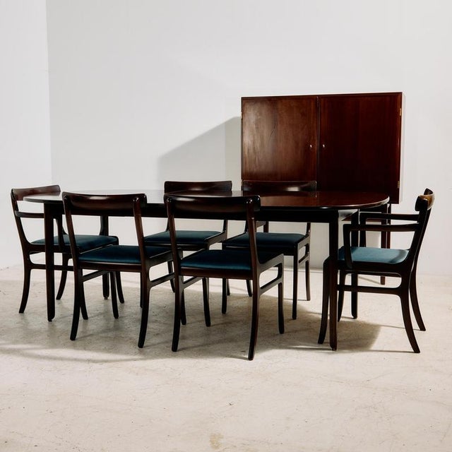 The ‘Rungstedlund’ mahogany dining set, designed by Ole Wanscher for Poul Jeppesen Møbelfabrik in the 1960s. The set...