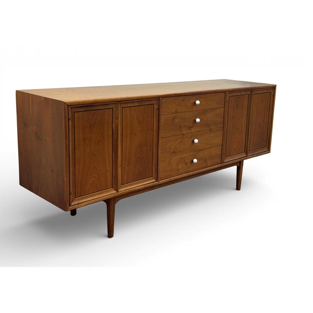 Mid-Century Drexel Declaration Walnut Sideboard, designed by Kipp Stewart and Stewart MacDougall Circa 1960. Features an...