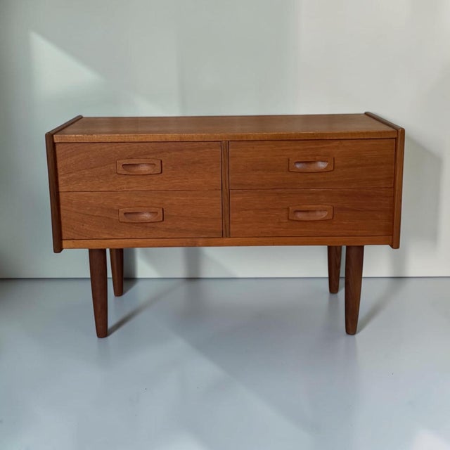 Elegant Mid-Century Modern Danish chest of drawers dating from the 1960s–1970s. Featuring clean Scandinavian lines,...