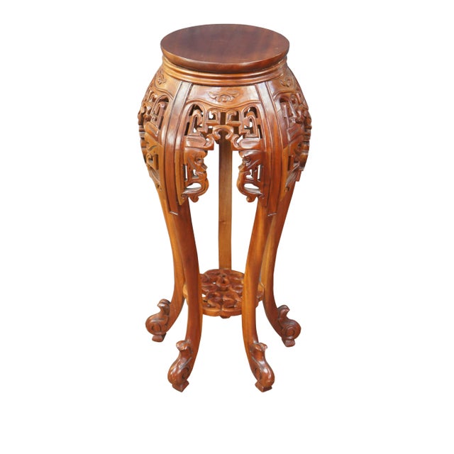 Mahogany carved Chinoiserie fern stand, circa last quarter 20th century. Features a solid wood construction with long...