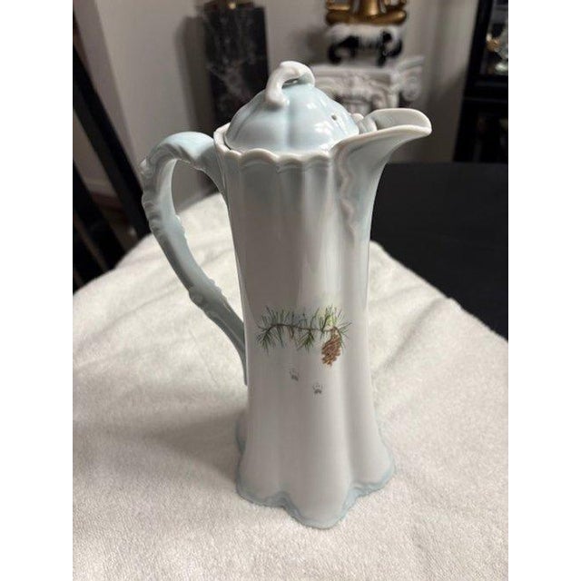 Hand-Painted Porcelain Chocolate Pot signed Jeanne, with the original lid present and a hand-painted dog and...
