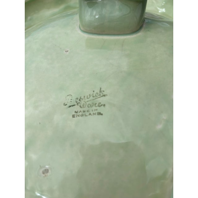 Beswick Footed Ceramic Fruit Bowl from the 1930's in the Art Deco style. It is light green with a floral center with...