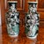 A fantastic pair of detailed and dramatic porcelain vases, the main decorative element comprised of mirrored flowering...