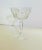 An elegant quartet of crystal champagne glasses featuring a faceted stem in excellent condition. Ships within 1-2 days...