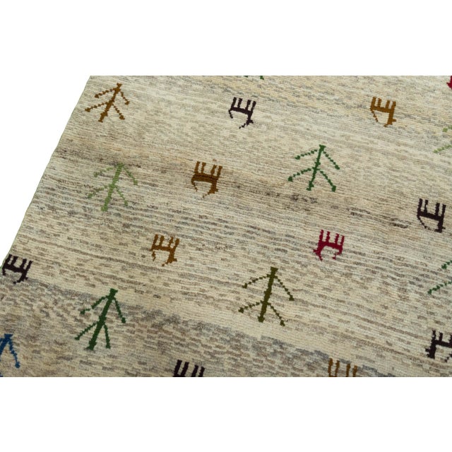 Hand-Knotted Gabbeh Nomadic Rug with Natural Tones & Symbolism For Sale - Image 5 of 11