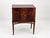 An elegant cabinet on four slender legs, combining Biedermeier simplicity with Empire-inspired decorative details. The...