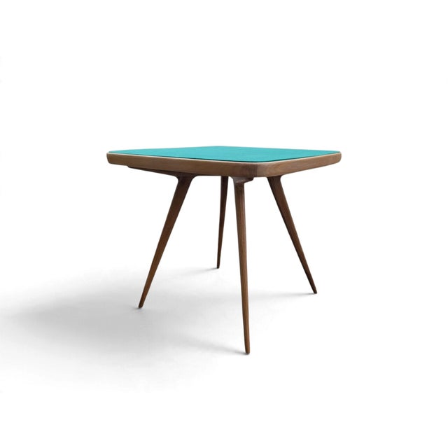 This elegant coffee table, fully restored, embodies the iconic style attributed to Cassina in the 1950s. The piece...
