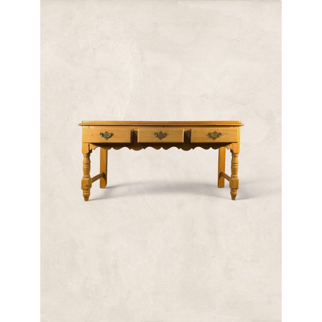 A charming English Antique Victorian console table crafted in solid pine and dating to circa 1880. Beautifully...