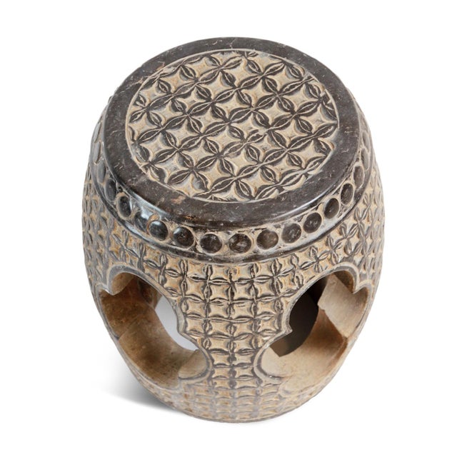 Vintage garden stool from North China hand-carved from dense black marble. Its surface is richly articulated with a...