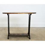 A wooden English oblong end table has been recently updated with new paint of ebonized effect and pasted découpage fish....