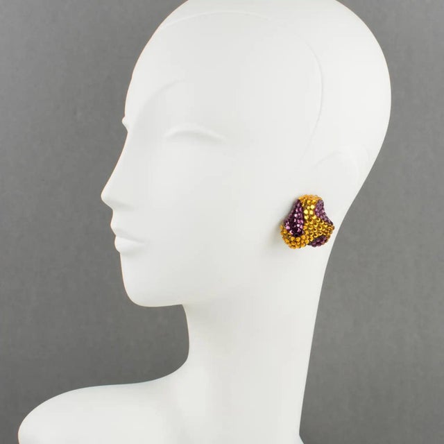 Richard Kerr designed those lovely statement clip-on earrings in the 1980s. The brand signature rhinestone paved design...