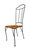 Bring warmth and character to your space with this striking rustic-modern dining chair, featuring a sculptural black iron...