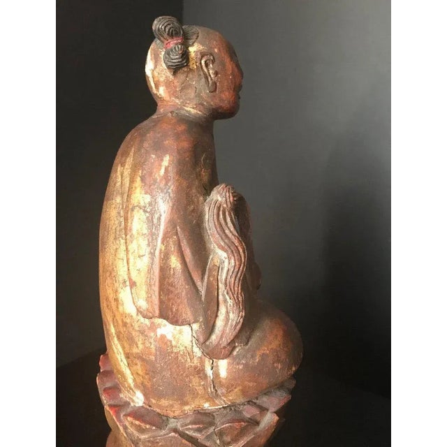 This is a rare and exquisite hand carved Daoist immortal figure. He is seated in a quiet meditation pose on a lotus...