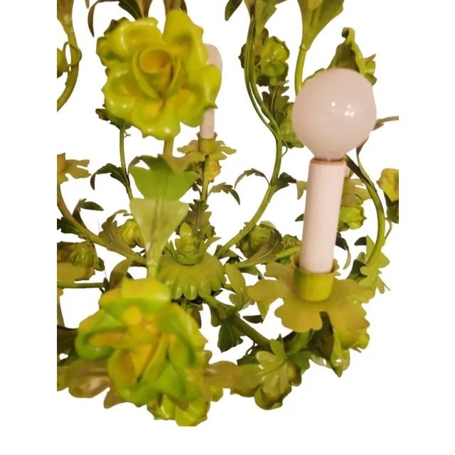 A vintage tole 5 light rose metal Regency chandelier. The chandelier was previously painted in a pretty pale lime green...