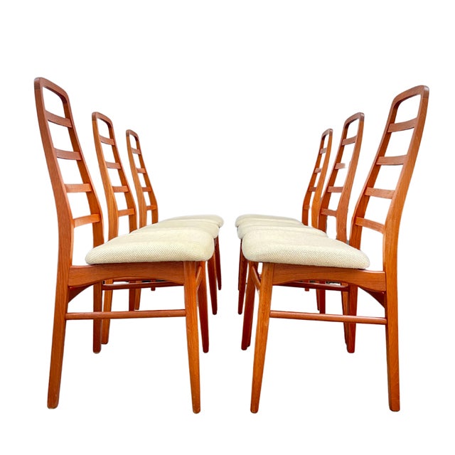Elevate your dining experience with this exquisite set of six danish teak dining chairs, a stunning representation of...