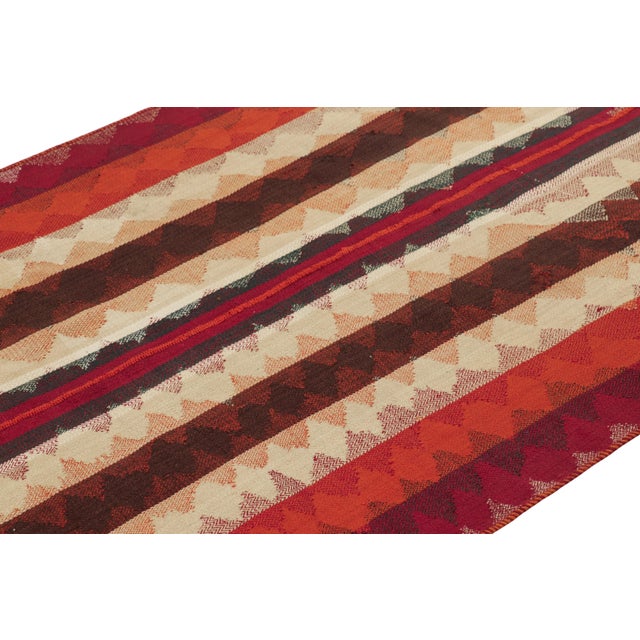 This vintage 4x8 Persian kilim runner is a mid-century Qashqai tribal rug, handwoven in wool circa 1950-1960. On the...