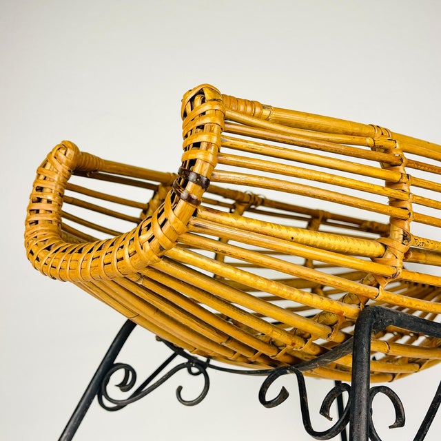 Rare original Italian rattan stand. Made in Italy in the 1960s. The vintage magazine rack is in good vintage condition....