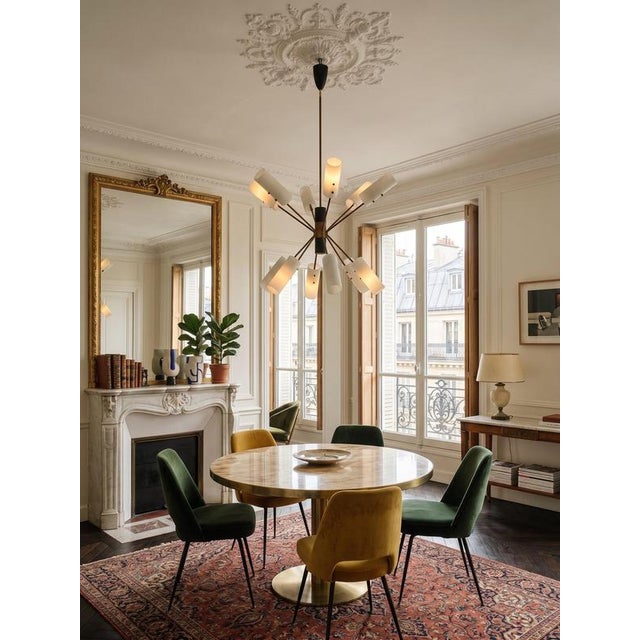 This magnificent mid-century chandelier is attributed to renowned Italian designer Angelo Lelii for Arredoluce. from the...