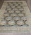 an early 20th Century Antique Persian Bidjar rug with a large scale all over floral pattern in light blues, camel, soft...