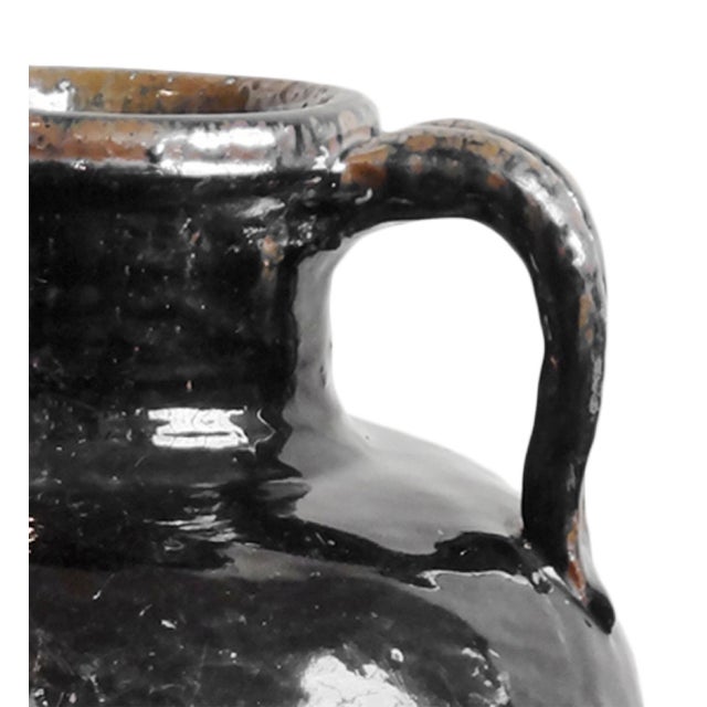 Rich with history and handcrafted character, this vintage Mongolian ceramic wine jug was traditionally used for storing...
