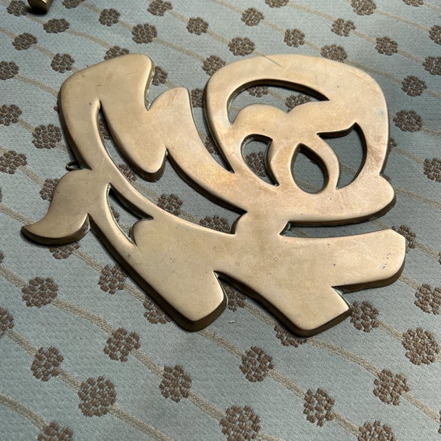 The Brass Asian Symbol is an elegant and culturally significant decorative item, showcasing a traditional Asian character...