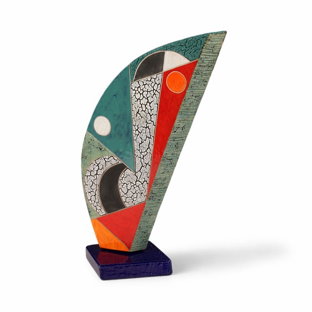 A large, open form with a calm, expansive presence. The front is composed of soft sage, warm orange, yellow, red, crackled...