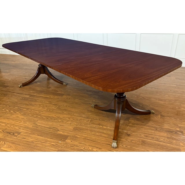 This is the Classic Traditional Georgian Style Mahogany Dining Table by Leighton Hall. It features a classic understated...