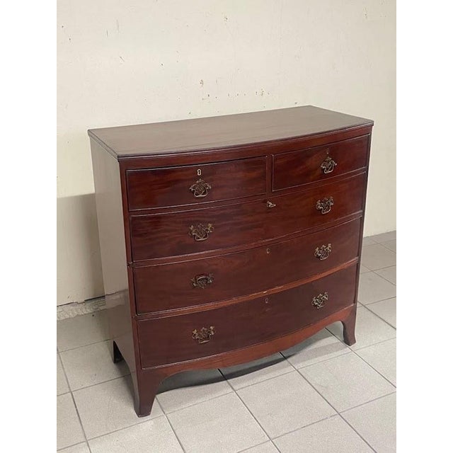 Mahogany chest of drawers in the late 18th/early 19th century English style (Hepplewhite or Regency line) made in Italy in...