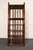 Vintage bookshelf/etagere unit with six surfaces (ca. 1970s, France). Composed of a stained bamboo frame with woven rattan...