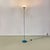 Floor lamp with blue metal structure with a round base. Inverted cone-shaped diffuser in opaque glass, with internal part...