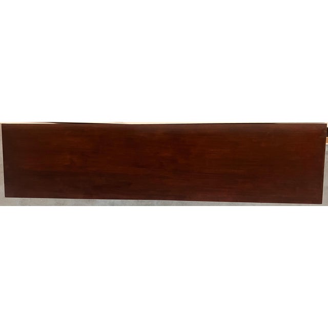 Dining table made of walnut with carved lyre legs and heavy top. The lyre legs are very thick. Beautiful iron stretcher,...