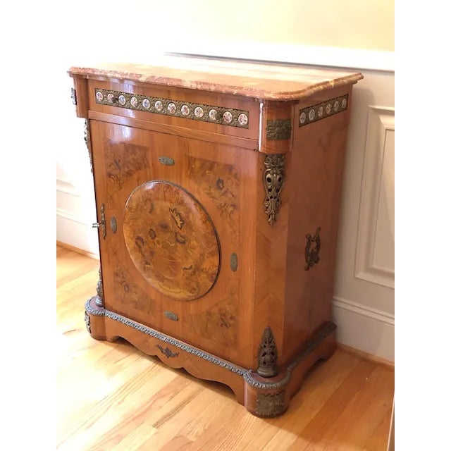 Antique French marquetry Ormolu Louis XV pier cabinet with marble top, applied ormolu and inlaid decoration plus enamelled...